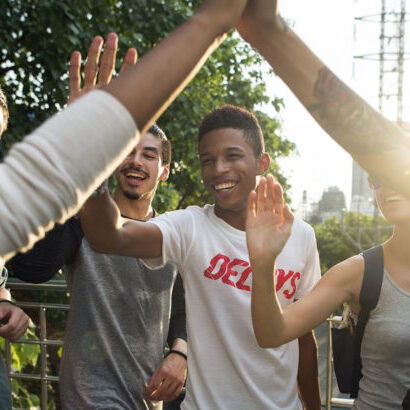 Friends giving high fives